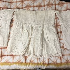 A very detailed white off shoulder top .Worn only once, in a great condition!